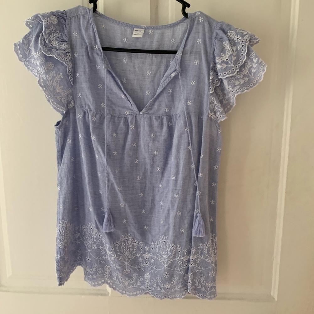 Blue top with white embroidery and tassles